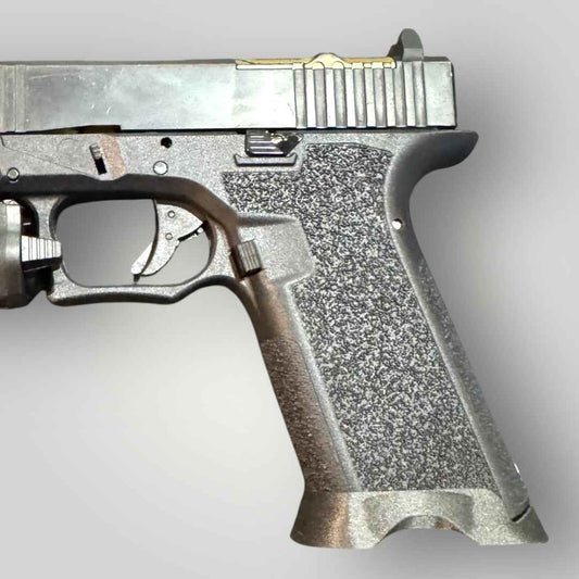 Tactical PA6-CF carbon fiber magwell on a pistol, side view